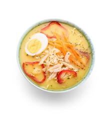 Bowl of tasty Thai soup on white background