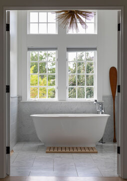 Beautiful Bathroom in home with large white bathtub 