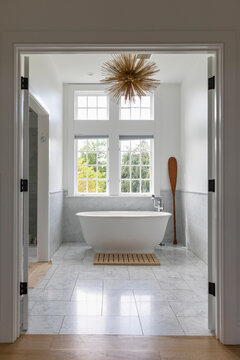 Luxury Bathroom in home with large white bathtub 