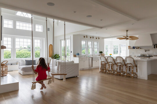Child Relaxing on Swing indoors at home