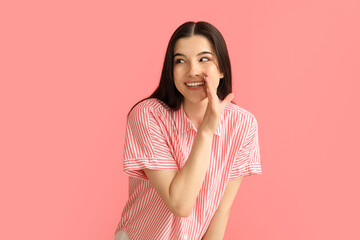 Young gossiping woman on color background