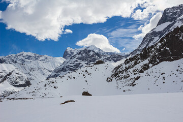 Trekking in winter season. Snowed mountains in La Egorda Valley, Cajón del Maipo, central Andes mountain range, Chile