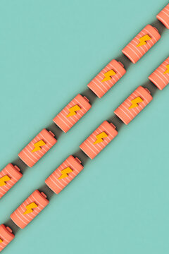 Pink Alkaline battery crossing the frame
