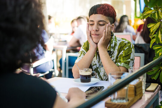 Gen Z latino trans man spending time with his mother