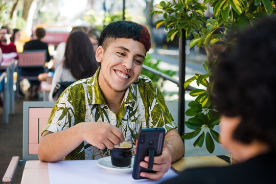 Gen Z queer man having coffee with his mother