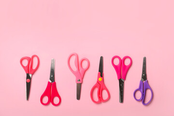 Many scissors on color background