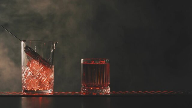 Negroni cocktail on the bar in smoke