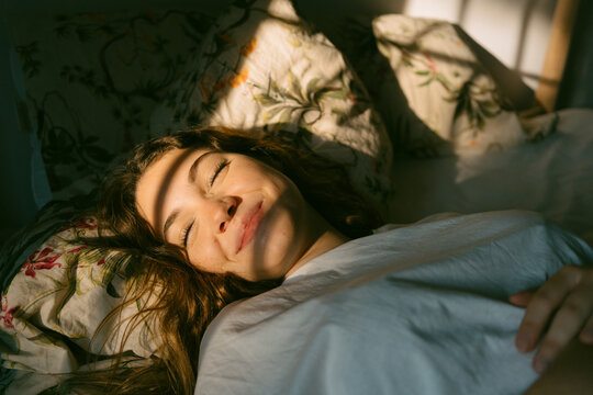 Beautiful woman sleeping at dawn