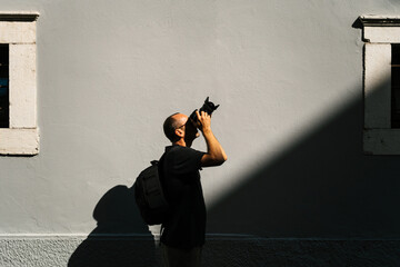 Photographer taking pictures of building