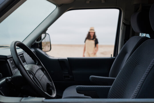Unrecognizable woman outside her camper van
