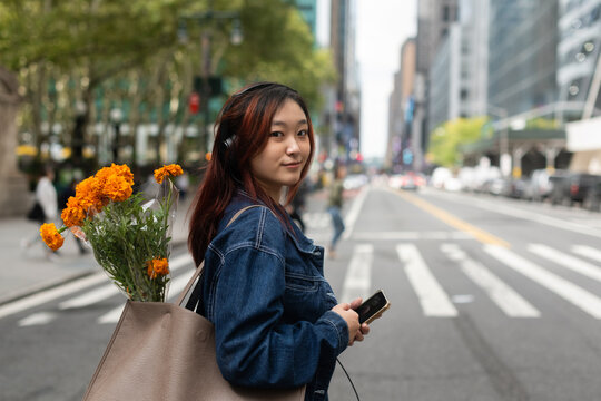 Young person looking at camera with small smile