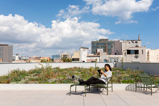 woman relaxing at rooftop