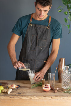 Mixologist Preparing Drink With Fruit 