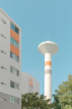 Orange patterned water tower and building.