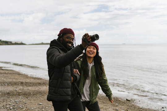 Couple Taking Pictures with a Camera