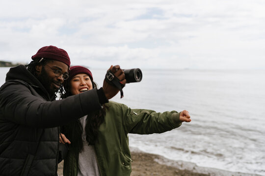 Couple Taking Pictures with a Camera
