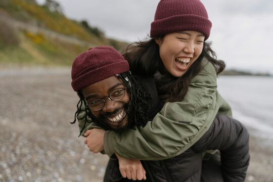 Couple Having fun on the Beach in Autumn