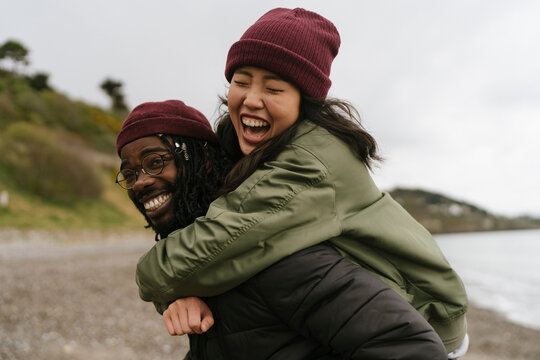 Couple Having fun on the Beach in Autumn