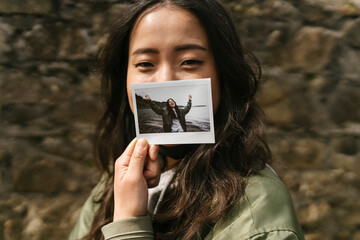 Woman With an instant Picture of Herself 