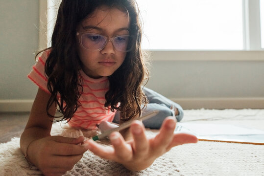 Child counting on fingers. 
