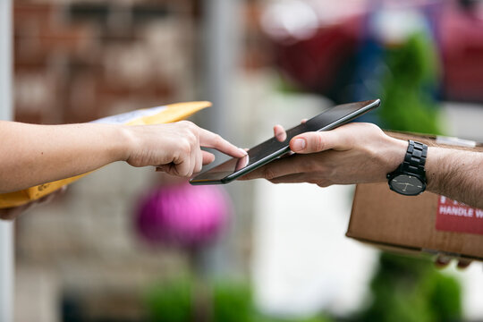 Shipment: Homeowner Signs For Delivered Package