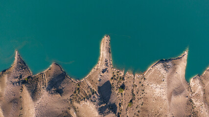 drone overhead view of a blue mountain river