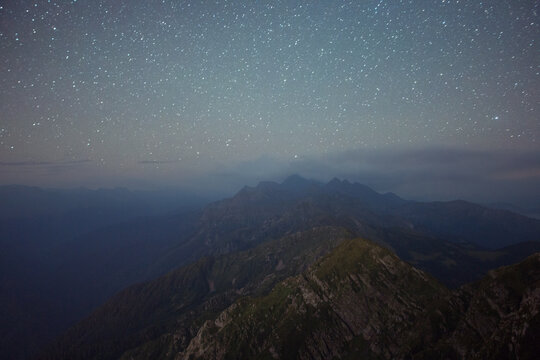 Mountain range under amazing night sky