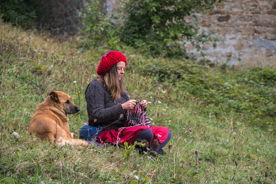 mature woman knits in nature