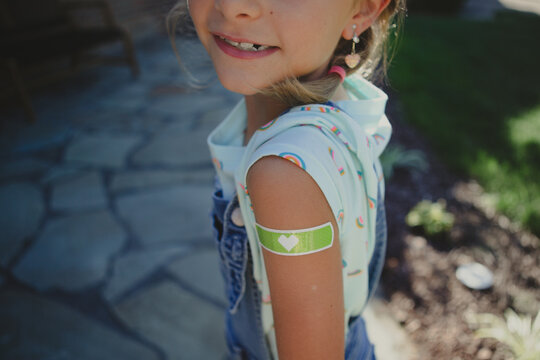 Young Girl Shows Off Bandaid From Her Vaccine Shot