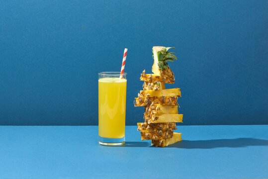 Glass Of Pineapple Juice On A Blue Background