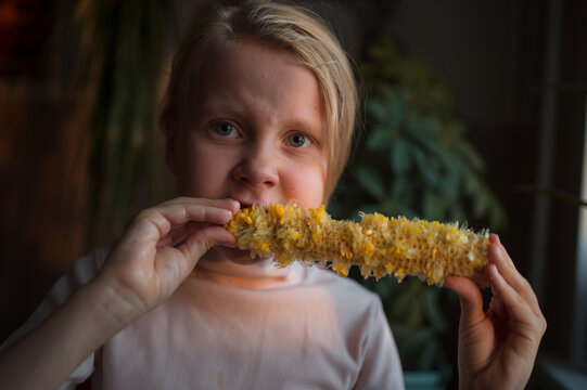 Cute girl finishing corn