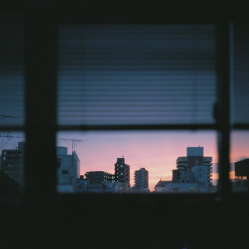 sunset over city through window
