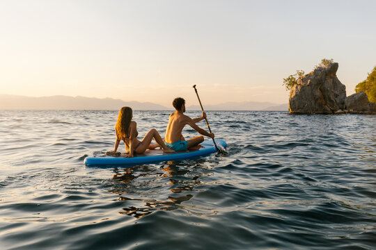 Couple on a sup board 
