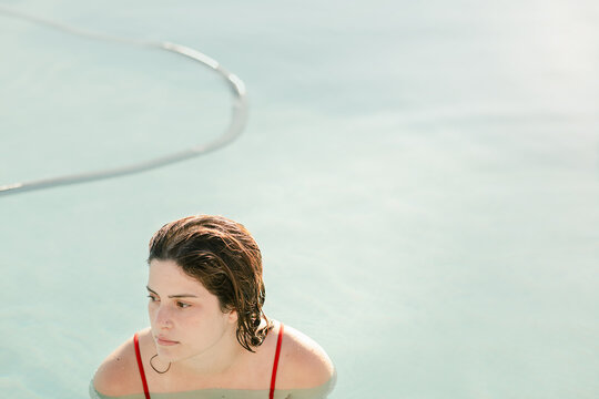 Young woman swimming at pool
