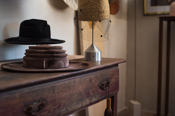 Stunning and elegant red hat displayed in the atelier