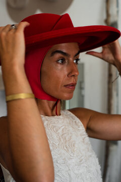Woman looking at herself in the mirror