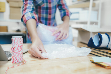 Obraz na płótnie Canvas Online business owner preparing product to customer.