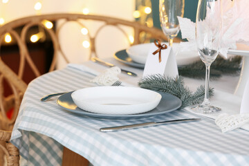 Dining table with setting for Christmas celebration indoors