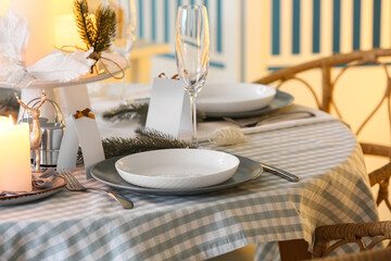 Dining table with setting for Christmas celebration indoors