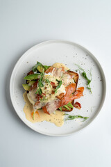 Very yummy and appetizing salmon sandwich on sweet brioche with hollandaise sauce, top view, menu photo