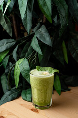 Different mojitos standing in a row on a black wooden bar counter, trendy bar photo