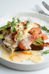 California healthy breakfast in a trendy coffee house, salmon and poached egg song with, white minimalistic photo