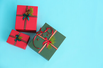 Beautiful Christmas gift boxes on blue background