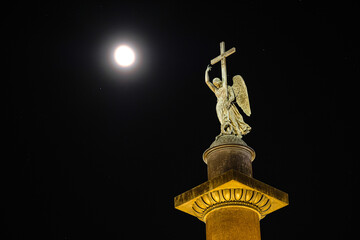 St. Petersburg, Russia - November, 23, 2021: Alexandrian Pillar and the moon under the background