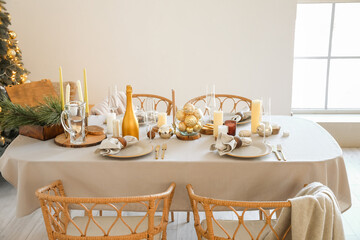 Dining table with setting for Christmas celebration indoors