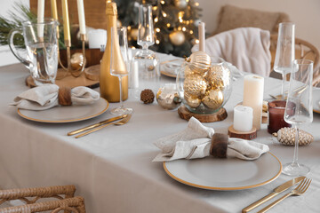 Dining table with setting for Christmas celebration indoors