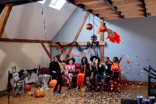 Family having fun during pinata games