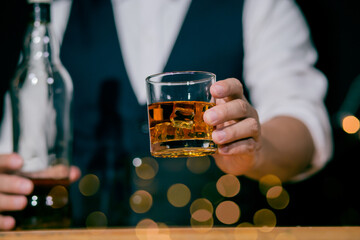 Barman pouring whiskey whiskey glass beautiful night