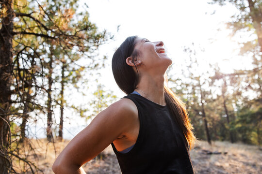 Laughing woman outside after run