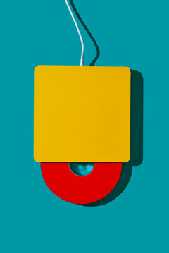 red cd in a yellow cd reader